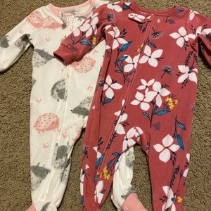 2 pairs of fuzzy footie pyjamas